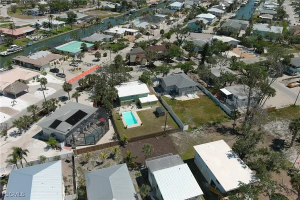 an aerial view of residential houses with outdoor space