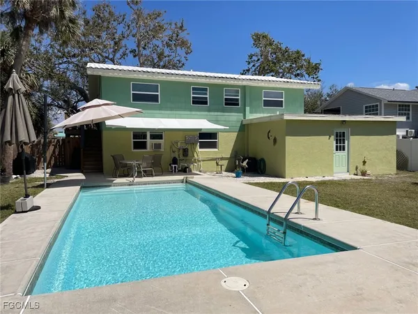 a view of a backyard with a patio