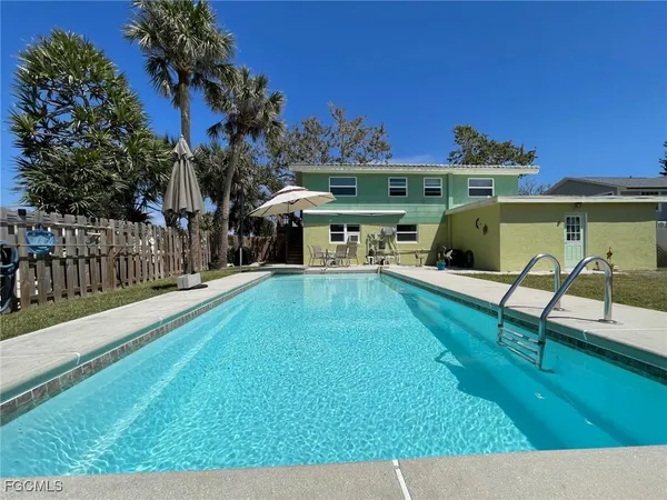 a view of a swimming pool with a patio
