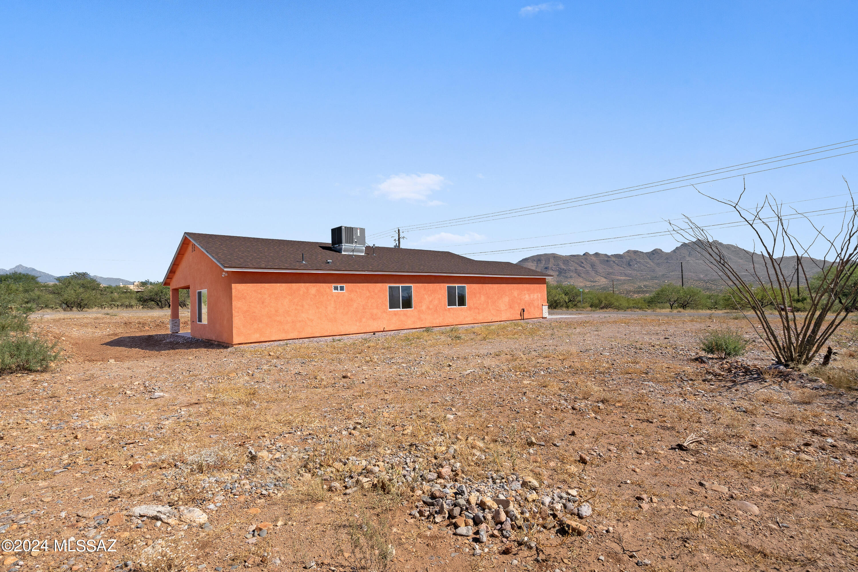 91 Avenida De Las Naciones Rio Rico, AZ 85648 - Photo 26 of 36 a front view of a house with a yard