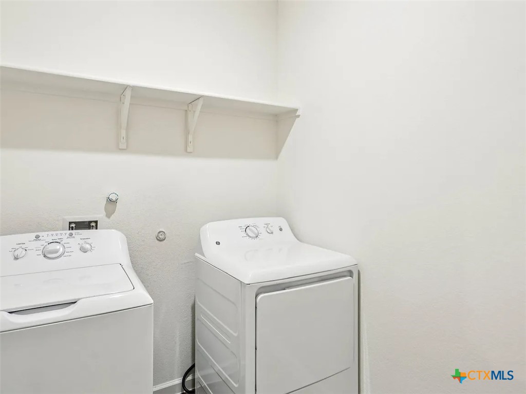 152 Mullen Taylor, TX 76574 - Photo 12 of 20 a utility room with dryer and washer