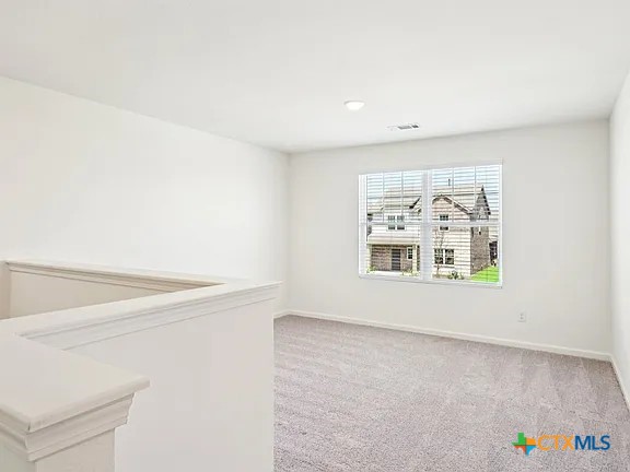 152 Mullen Taylor, TX 76574 - Photo 14 of 20 a view of an empty room with a window