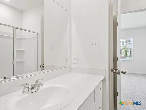 a bathroom with a sink and a mirror