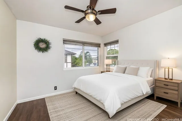 a bedroom with a large bed and a window