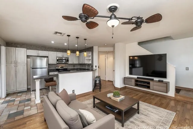 a living room with furniture and a flat screen tv
