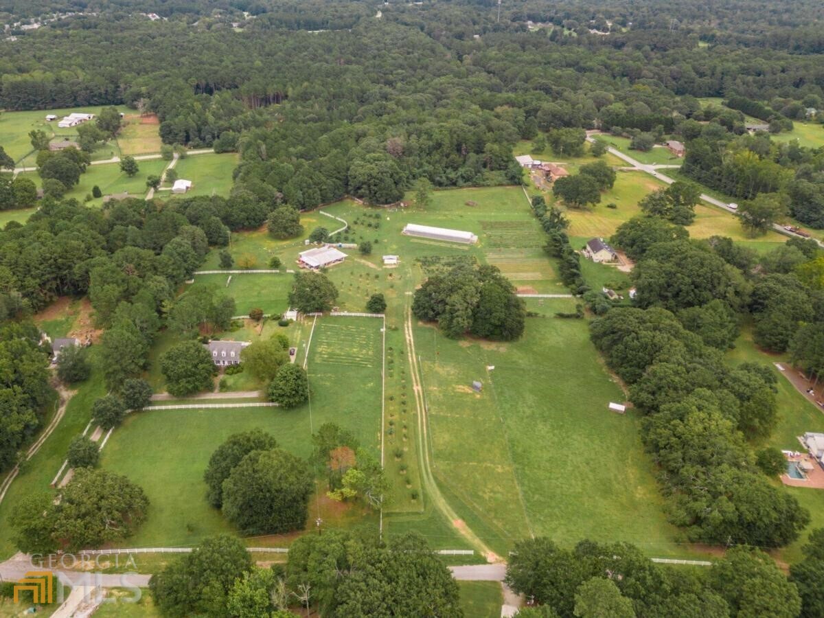 4725 Bryant Road Conyers, GA 30012 - Photo 1 of 1 a view of residential houses with outdoor space and trees