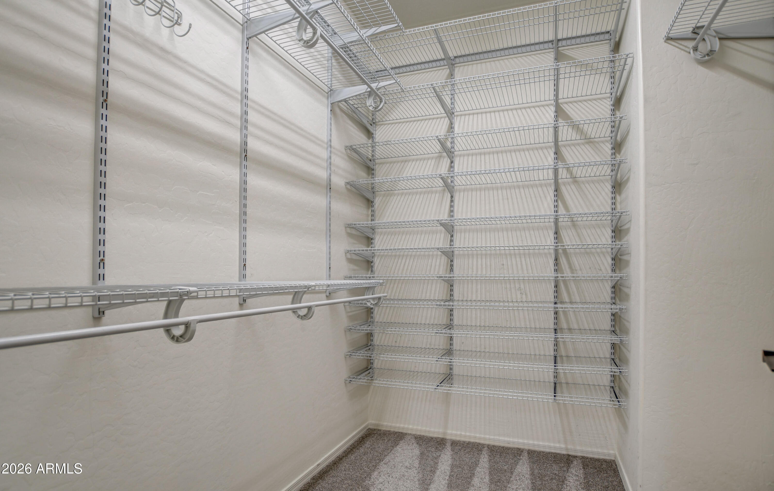 3078 East Muirfield Street Gilbert, AZ 85298 - Photo 64 of 92 a view of a room with racks on the wall