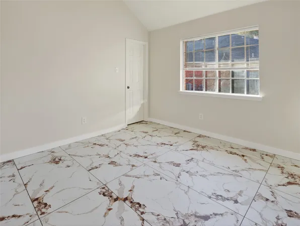 a view of empty room with windows