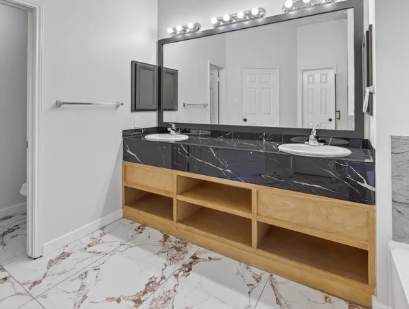 a bathroom with a sink and a mirror
