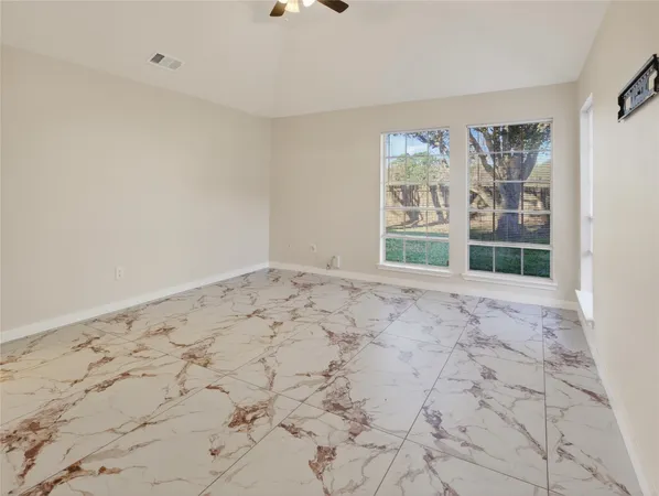 a view of empty room with windows