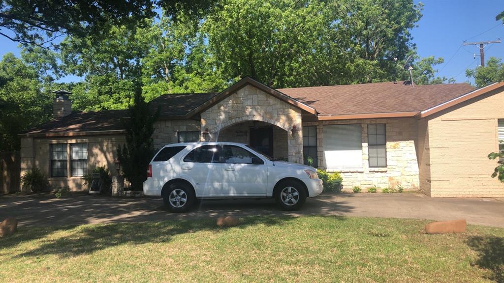 a car parked in front of a house