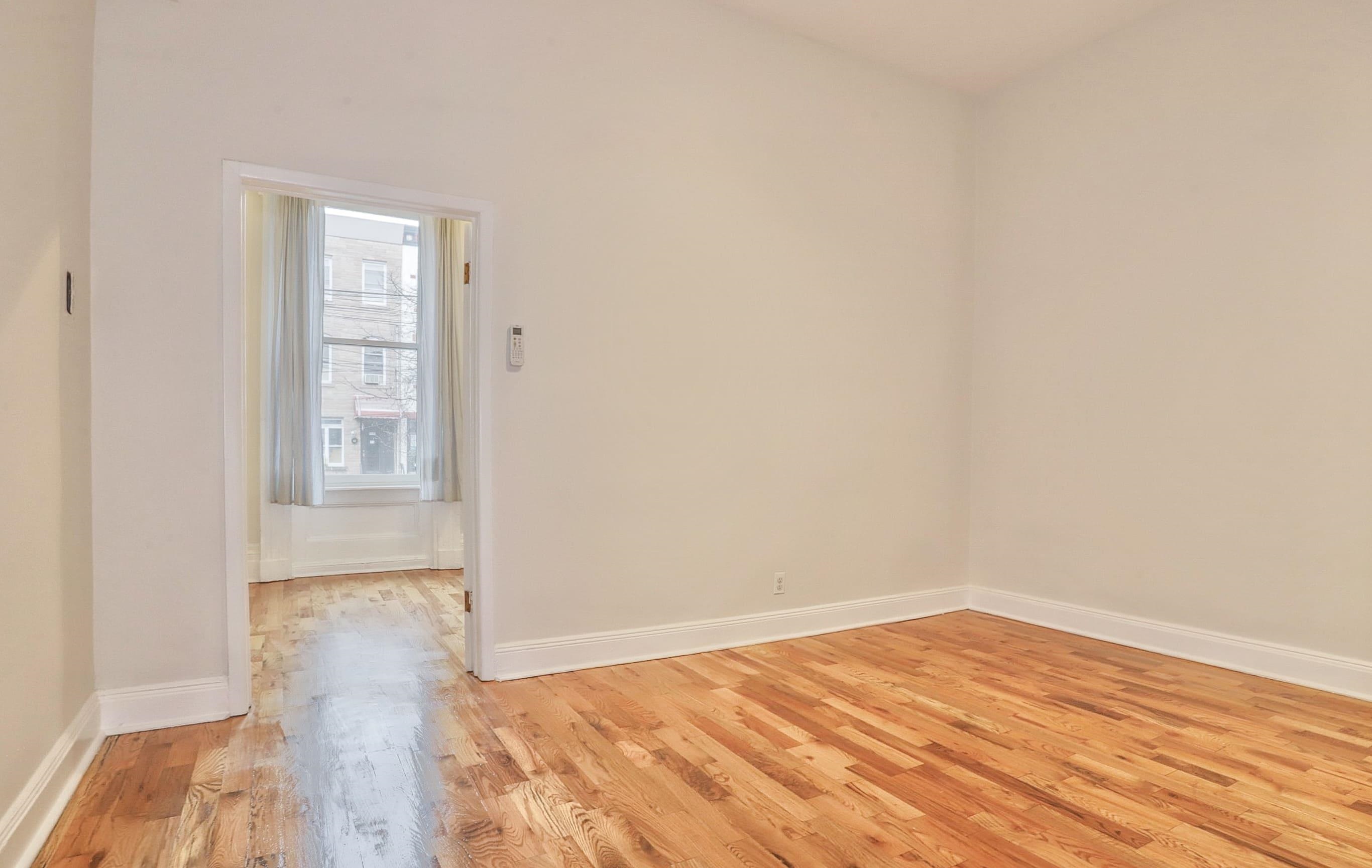 232 Garden Street, Unit 2 Hoboken, NJ 07030 - Photo 13 of 24 a view of empty room with wooden floor and fan