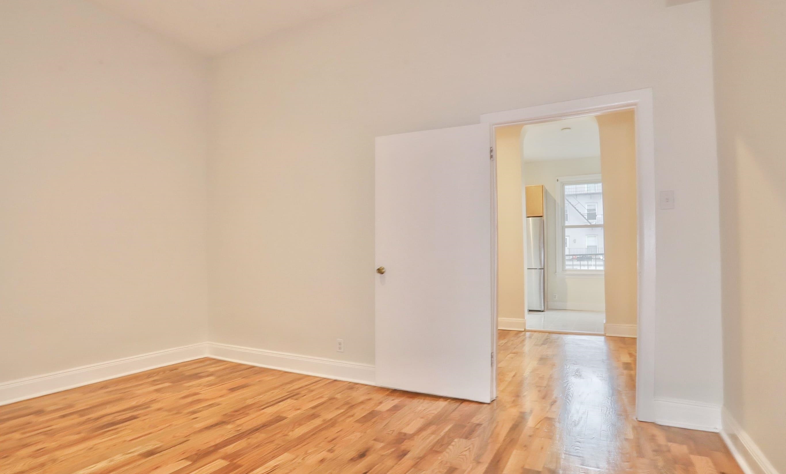 232 Garden Street, Unit 2 Hoboken, NJ 07030 - Photo 14 of 24 a view of an empty room and wooden floor