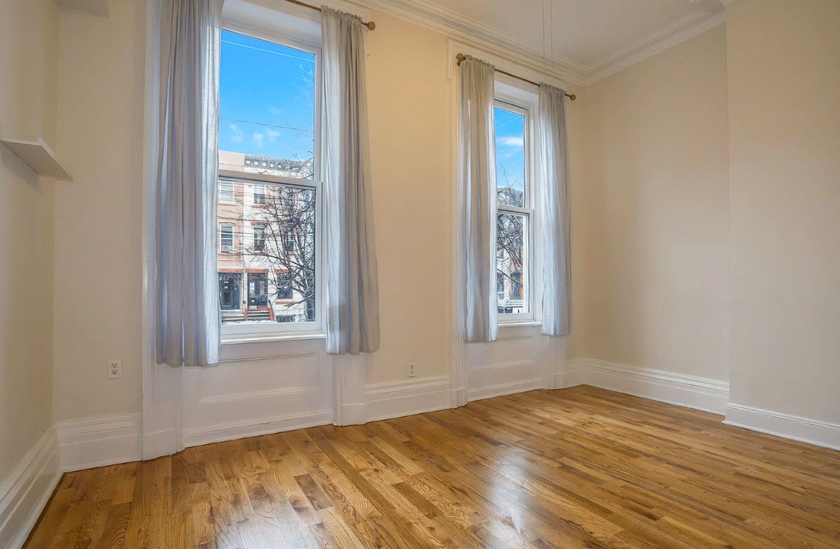 232 Garden Street, Unit 2 Hoboken, NJ 07030 - Photo 18 of 24 a view of empty room with wooden floor and fan