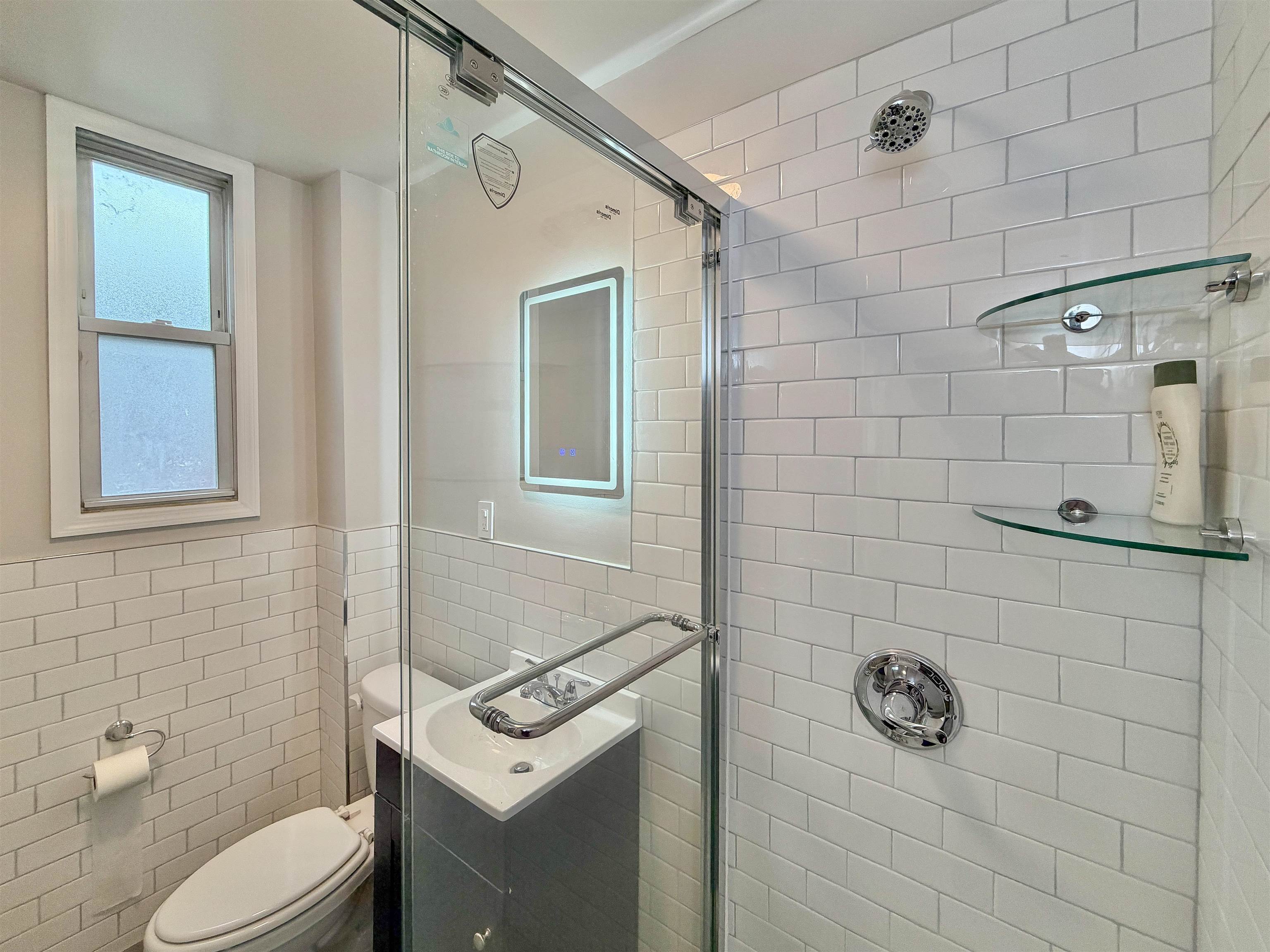 232 Garden Street, Unit 2 Hoboken, NJ 07030 - Photo 20 of 24 a bathroom with a toilet sink and shower