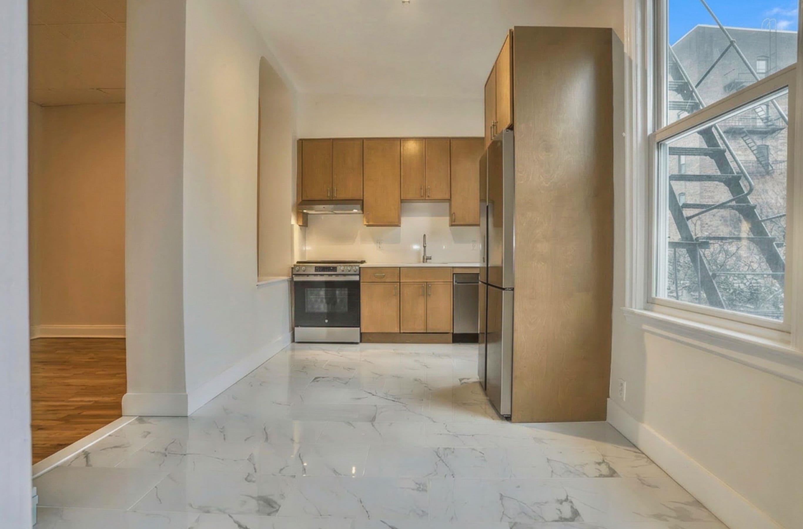 232 Garden Street, Unit 2 Hoboken, NJ 07030 - Photo 6 of 24 a view of a kitchen with furniture and a window
