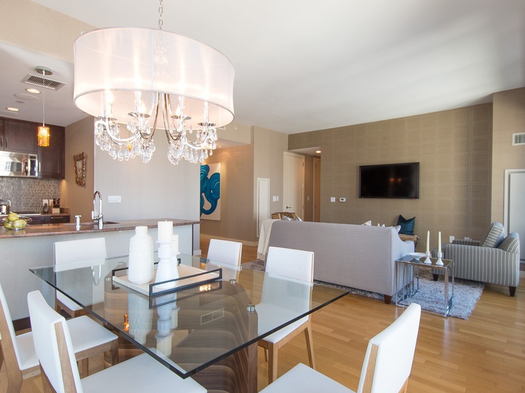 400 Stuart Street, Unit 21AA Boston, MA 02116 - Photo 2 of 22 a living room with fireplace furniture and a flat screen tv