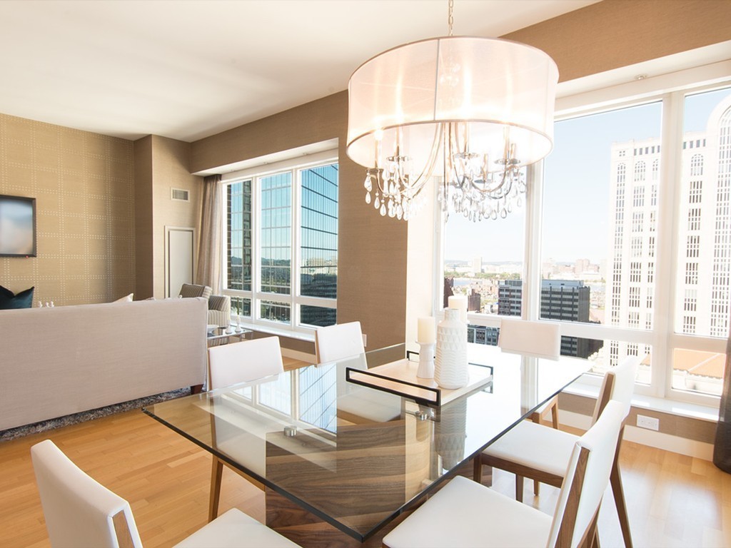 400 Stuart Street, Unit 21AA Boston, MA 02116 - Photo 3 of 22 a living room with furniture and a large window