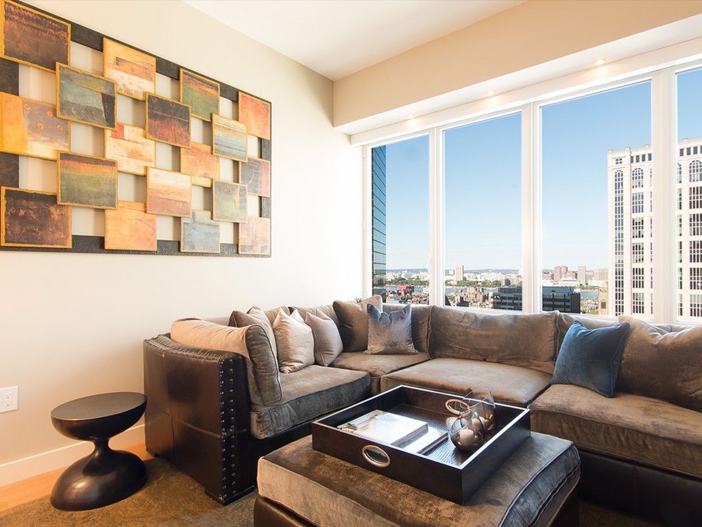 400 Stuart Street, Unit 21AA Boston, MA 02116 - Photo 7 of 22 a living room with furniture and a large window