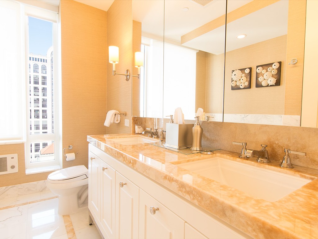 400 Stuart Street, Unit 21AA Boston, MA 02116 - Photo 9 of 22 a bathroom with a granite countertop sink toilet and shower