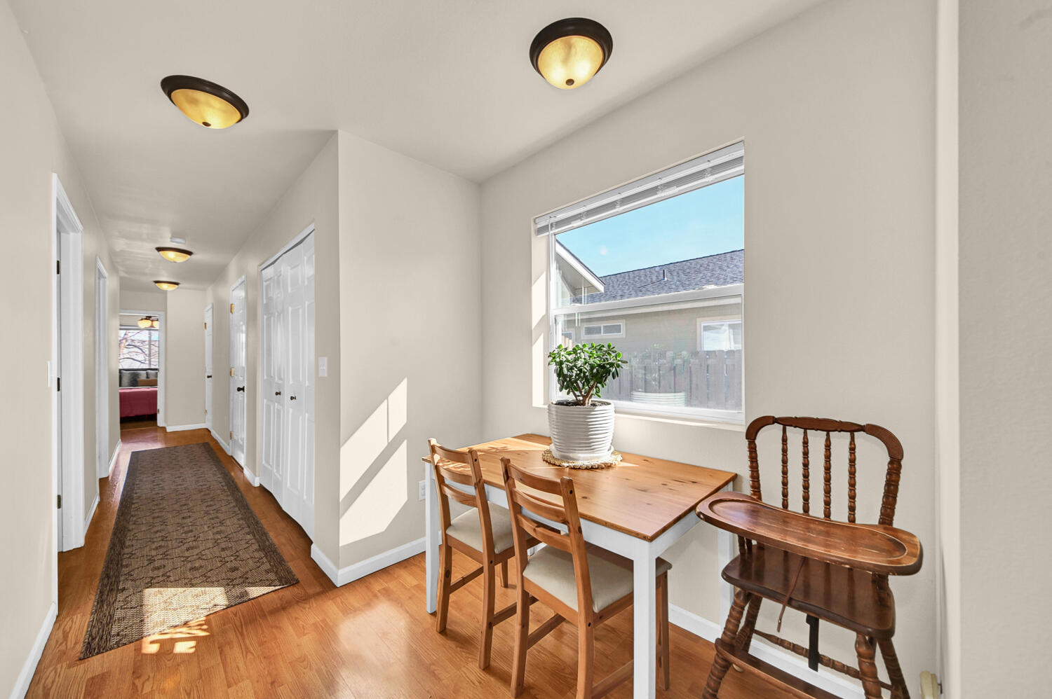 61258 Blakely Road Bend, OR 97702 - Photo 10 of 26 Cozy eating area and the hallway to the bedrooms.