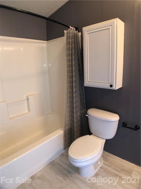 5526 Whiteside Road Bostic, NC 28018 - Photo 21 of 48 a bathroom with a toilet a sink and bathtub