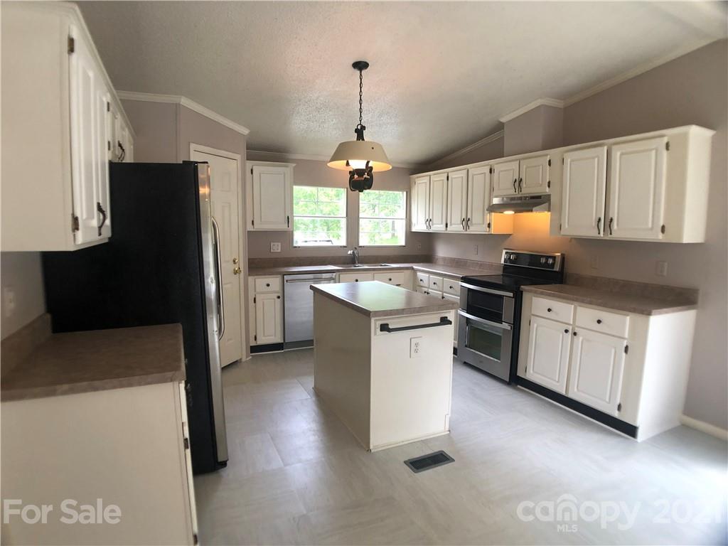 5526 Whiteside Road Bostic, NC 28018 - Photo 4 of 48 a kitchen with a sink stove and refrigerator