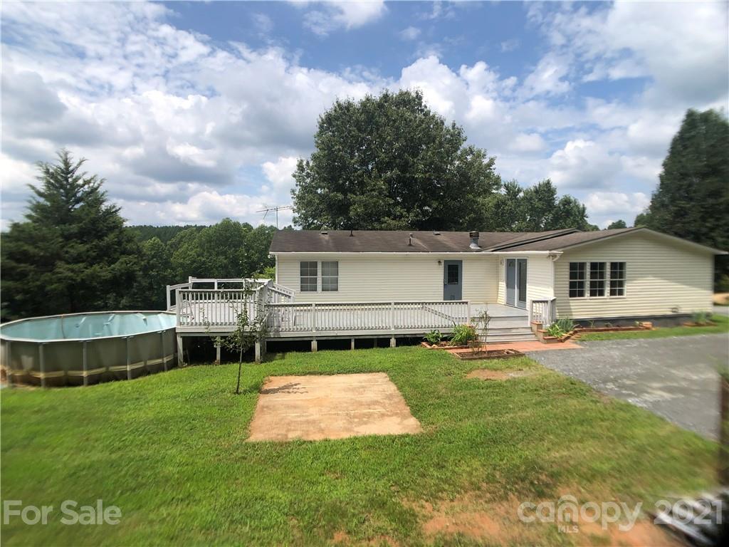 5526 Whiteside Road Bostic, NC 28018 - Photo 38 of 48 a backyard of a house with table and chairs