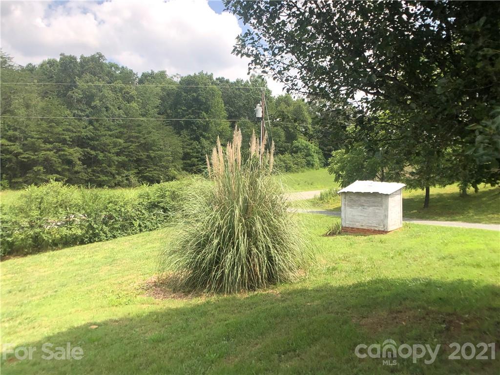 5526 Whiteside Road Bostic, NC 28018 - Photo 40 of 48 a garden with trees in the background
