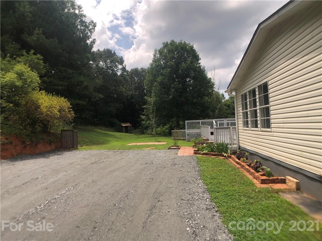 5526 Whiteside Road Bostic, NC 28018 - Photo 44 of 48 a view of a house with swimming pool and a yard