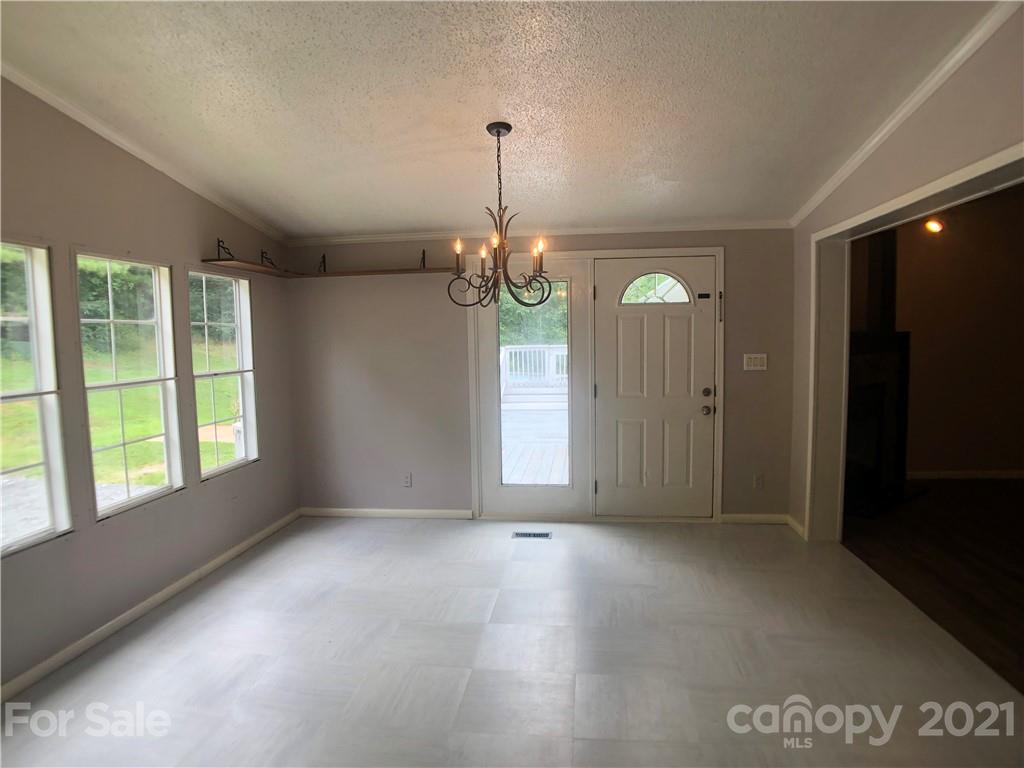 5526 Whiteside Road Bostic, NC 28018 - Photo 8 of 48 a view of a room with a chandelier fan and windows