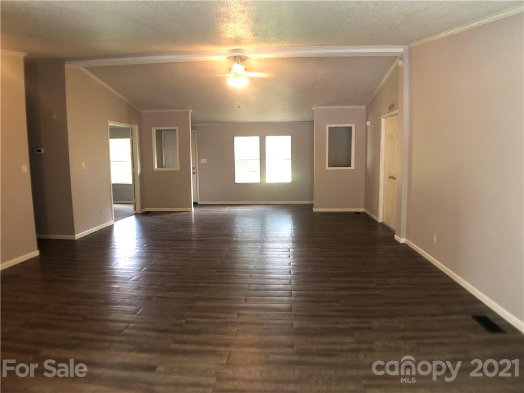 5526 Whiteside Road Bostic, NC 28018 - Photo 10 of 48 a view of an empty room with wooden floor and a window