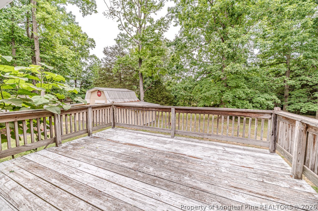 3384 Goldston Glendon Road Goldston, NC 27252 - Photo 28 of 47 a view of balcony with wooden floor and fence