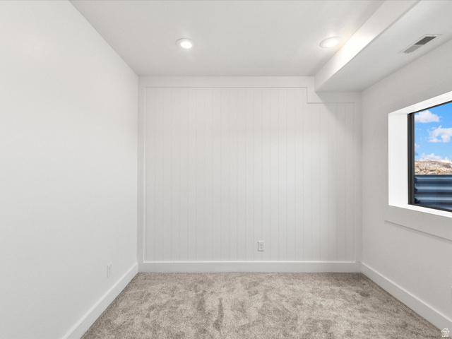 1225 Old Oregon Road Soda Springs, ID 83276 - Photo 19 of 67 Carpeted interior space featuring white walls, recessed lighting, and a white paneled accent wall