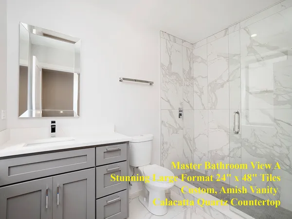 a bathroom with a sink a toilet and bathtub