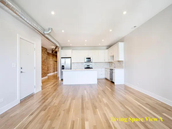 a view of kitchen with wooden floor