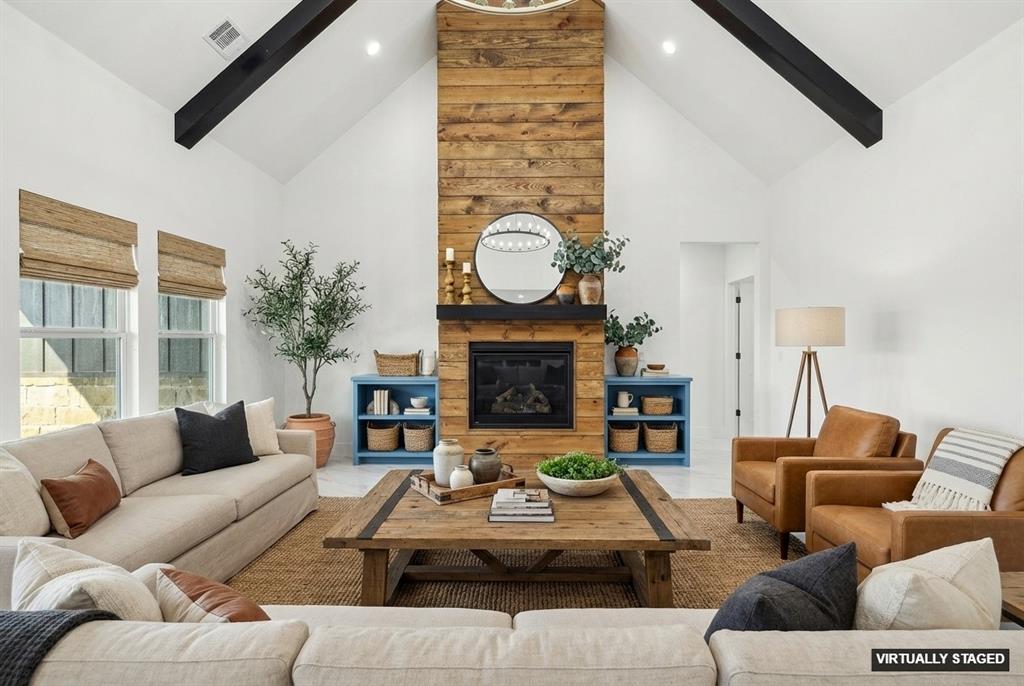 6657 Buffalo Ridge Circle Godley, TX 76044 - Photo 10 of 38 a living room with furniture a fireplace and a large window