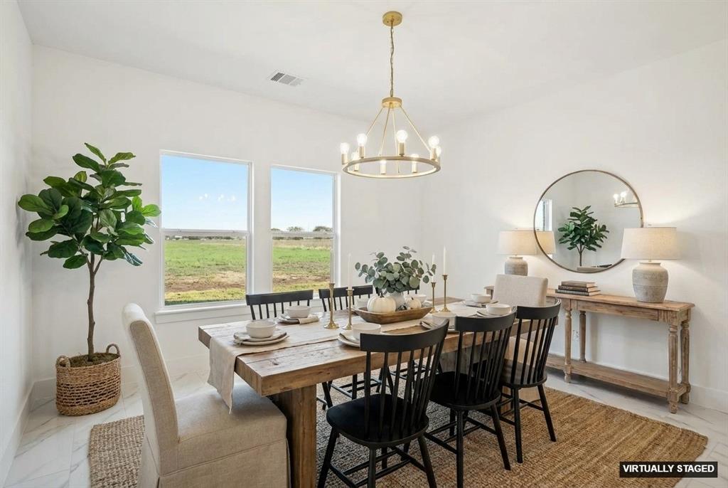 6657 Buffalo Ridge Circle Godley, TX 76044 - Photo 19 of 38 a view of a dining room with furniture window and wooden floor