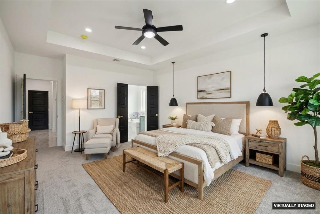 6657 Buffalo Ridge Circle Godley, TX 76044 - Photo 21 of 38 a bedroom with a large bed a chandelier and a couch