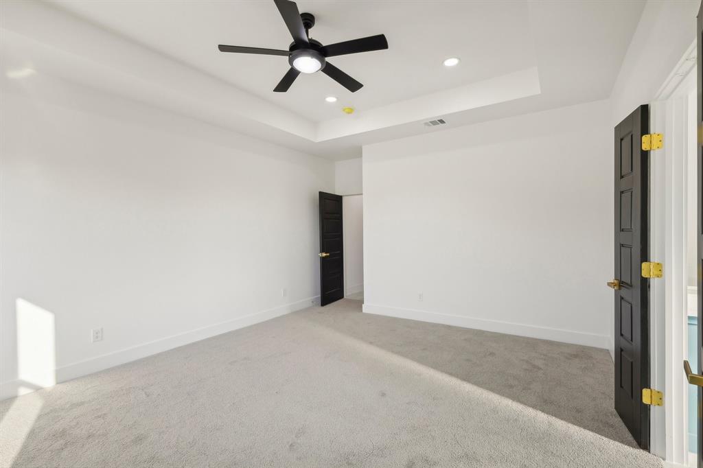 6657 Buffalo Ridge Circle Godley, TX 76044 - Photo 23 of 38 en empty room with ceiling fan and window