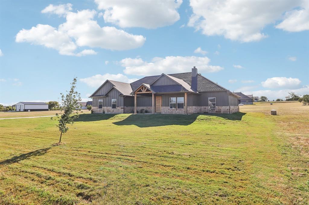 6657 Buffalo Ridge Circle Godley, TX 76044 - Photo 3 of 38 a swimming pool with outdoor seating and yard