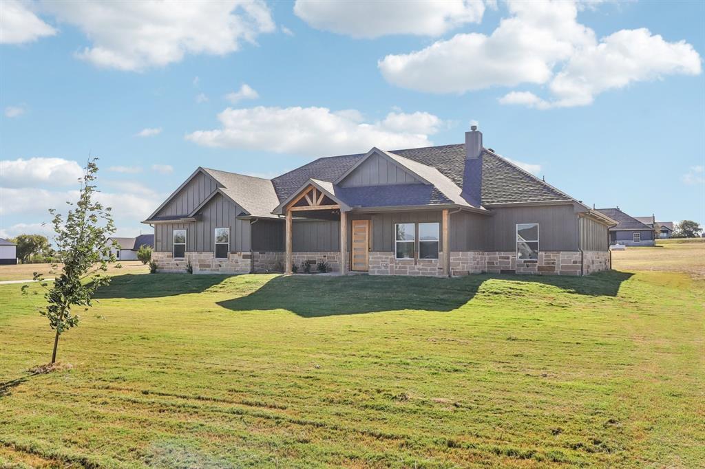 6657 Buffalo Ridge Circle Godley, TX 76044 - Photo 4 of 38 a front view of a house with swimming pool