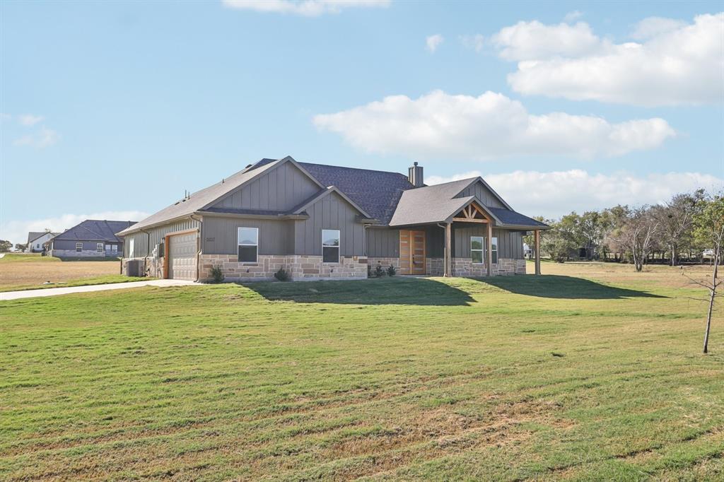 6657 Buffalo Ridge Circle Godley, TX 76044 - Photo 5 of 38 a front view of house with yard and lake view