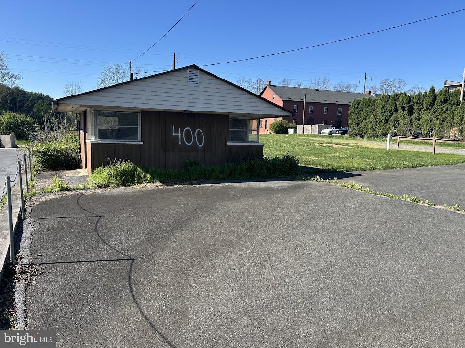 400 East Main Street Mount Joy, PA 17552 - Photo 2 of 15 a front view of a house with a yard and garage