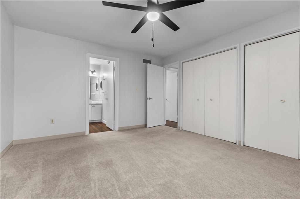 2006 Kenzie Road Pittsburgh, PA 15205 - Photo 11 of 22 This inviting primary bedroom features freshly painted walls, a comfortable lighted ceiling fan for optimal air circulation, the convenience of double closets for ample storage, and an ensuite master bath.