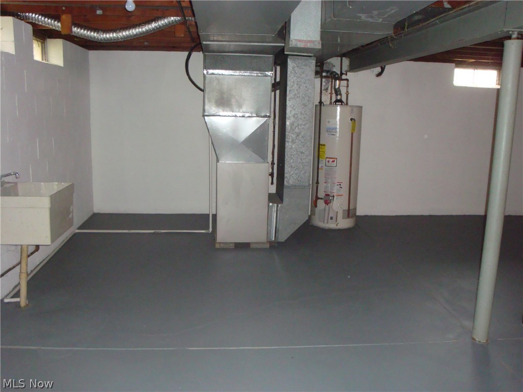 9740 Ridgeview Trail Mentor, OH 44060 - Photo 24 of 30 BASEMENT MECHANICALS AND WASH TUB AREA.