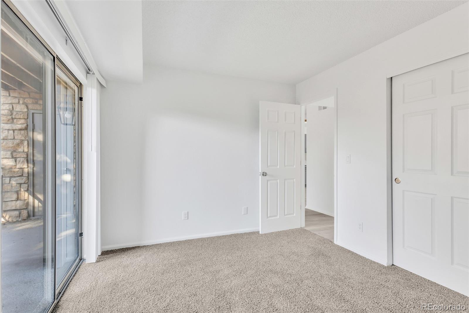 2575 South Syracuse Way, Unit J108 Denver, CO 80231 - Photo 13 of 18 a view of an empty room