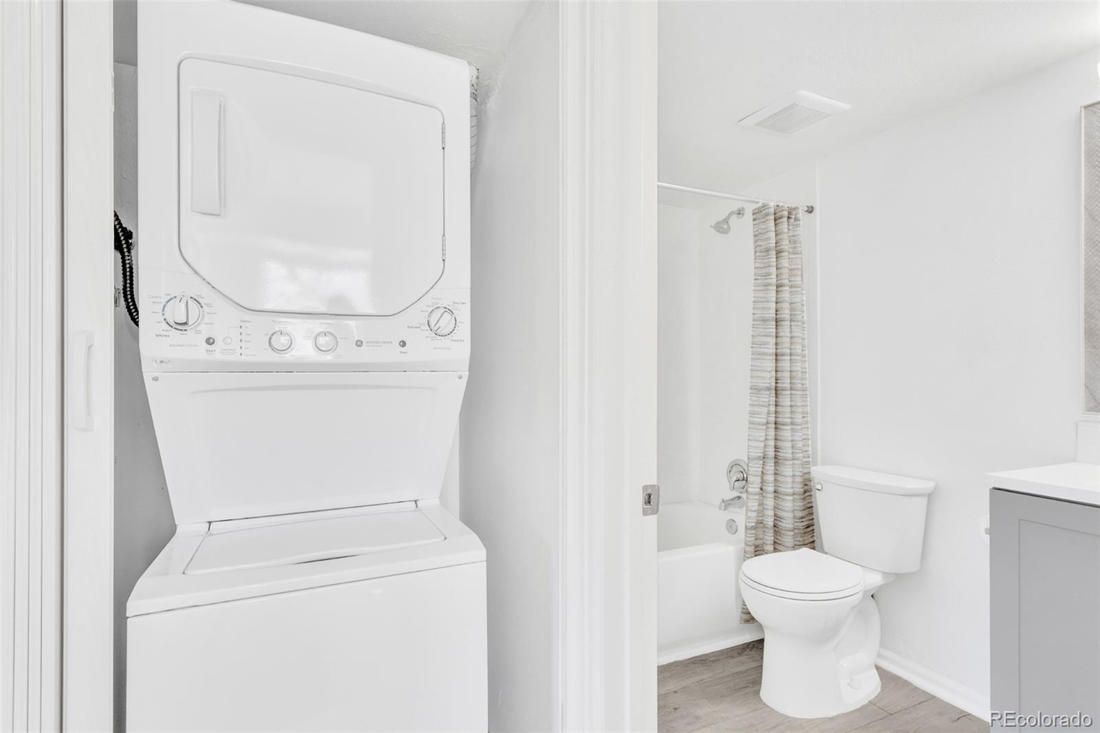 2575 South Syracuse Way, Unit J108 Denver, CO 80231 - Photo 15 of 18 a bathroom with a toilet and a sink