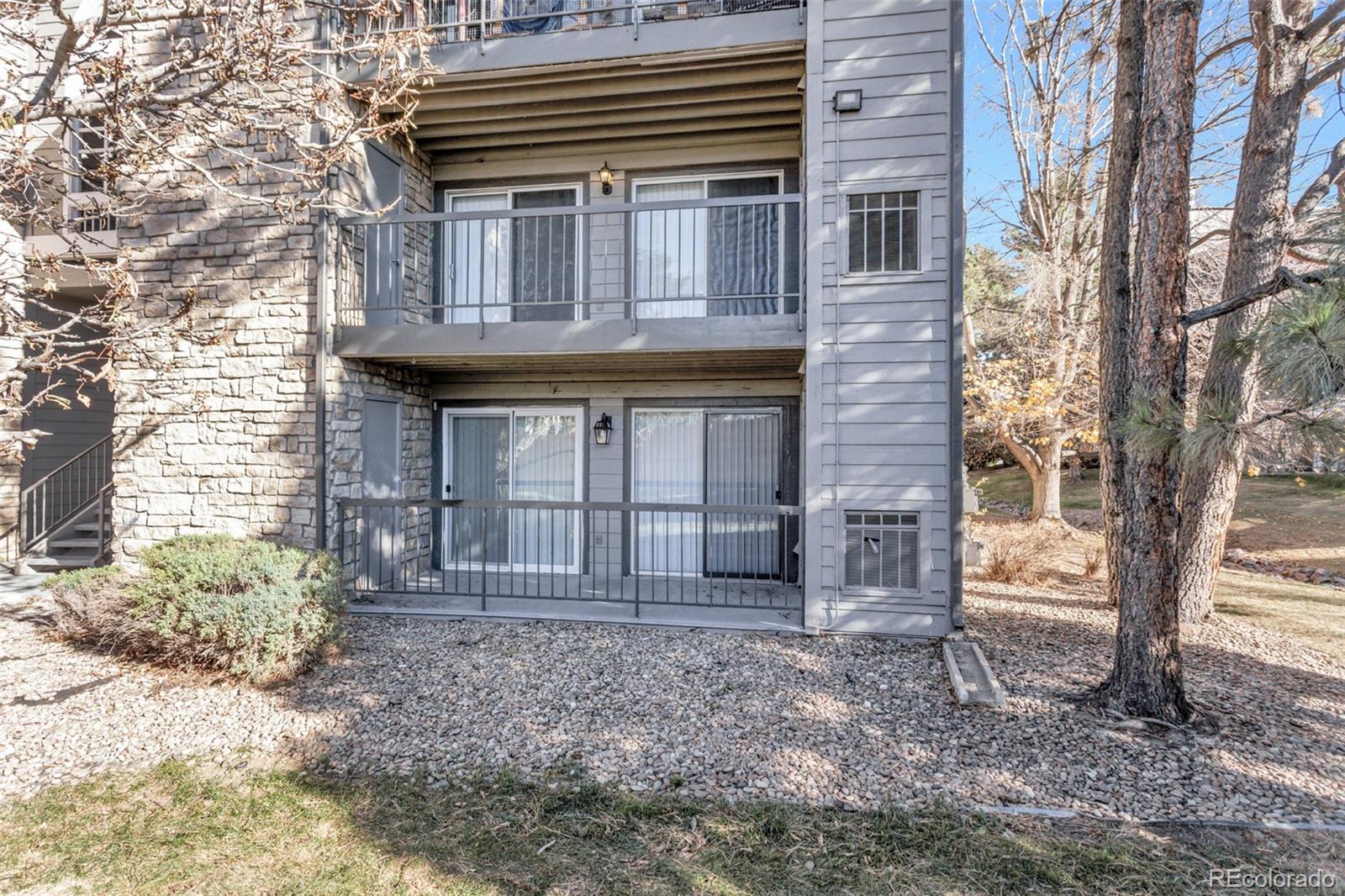 2575 South Syracuse Way, Unit J108 Denver, CO 80231 - Photo 17 of 18 a view of a house with a backyard