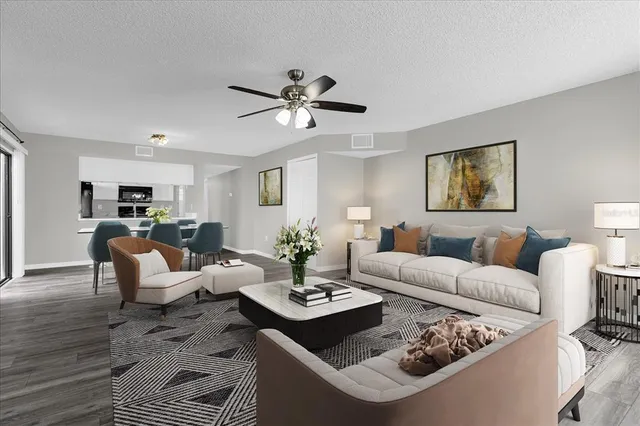 a living room with furniture or couch and a dining table